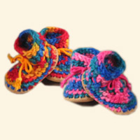 Hand crocheted in wool with a suede sole and sheepskin insole